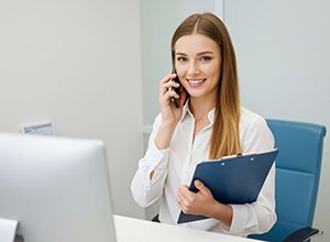 Happy dental patient making thumbs up gesture