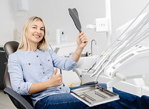 Dental team member sitting at desk, making phone call