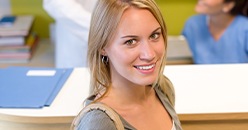 Smiling blonde woman in dental office