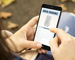 Using mobile phone to look up information about dental benefits