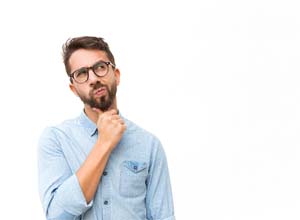 Man deep in thought, has questions about dental emergencies