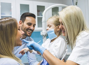 family visiting dentist