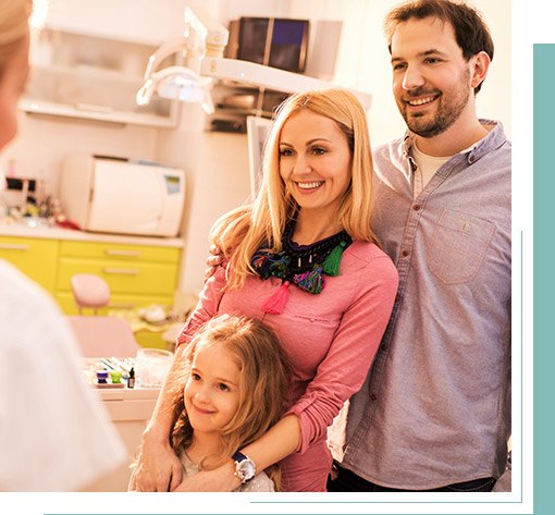 Father mother and daughter in dental office