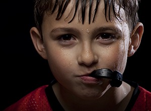 Young boy with black sportsguard