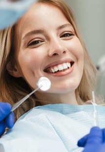 woman smiling while visiting dentist 