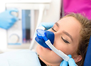Female patient relaxing while wearing nitrous oxide nose mask