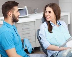 Dentist and female patient discussing sedation dentistry options
