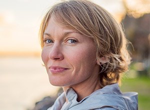 Woman smiling at sunset