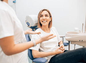 Patient and dental team member discussing treatment options