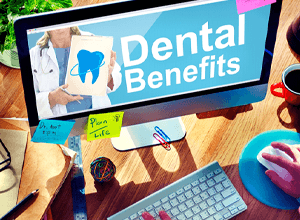 Using computer to research information about dental benefits
