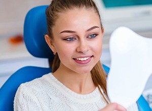 dental patient looking in mirror