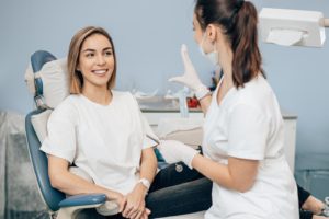 Patient and dental team member discussing gum disease therapy