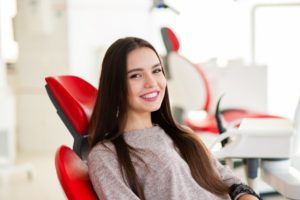 Smiling patient at appointment to use her dental insurance in Enfield 