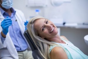 Smiling dental patient at appointment for a root canal in Enfield