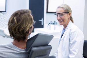 Dentist and patient conversing about treatment options