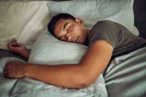 Man sleeping peacefully after wisdom tooth extractions